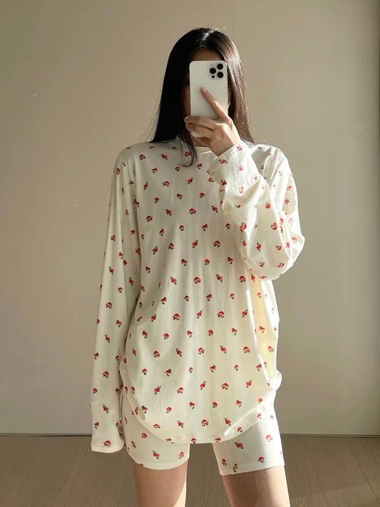 Cream long-sleeve pajama top and matching shorts with small red strawberry print